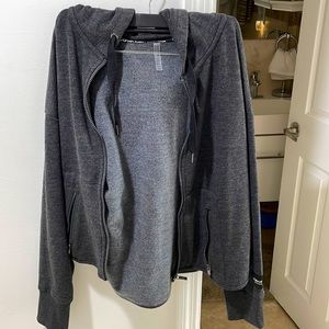 A grey medium Calvin Klein zip up sweatshirt